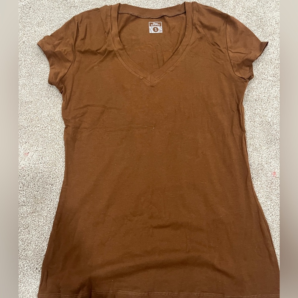 Deep tan shirt, very stretchy and soft could fit up to large